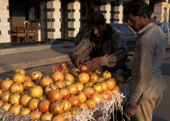Selling Pomegranates at Street Market 